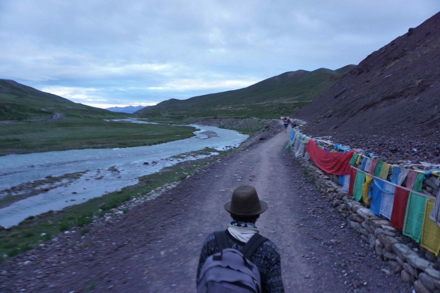 My pony man walks ahead. Prayer flags along the Parikrama route.